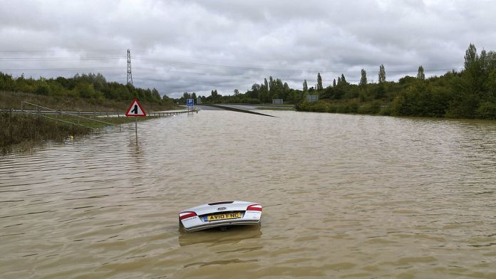 Football pitch collapses as parts of the UK hit by flash floods