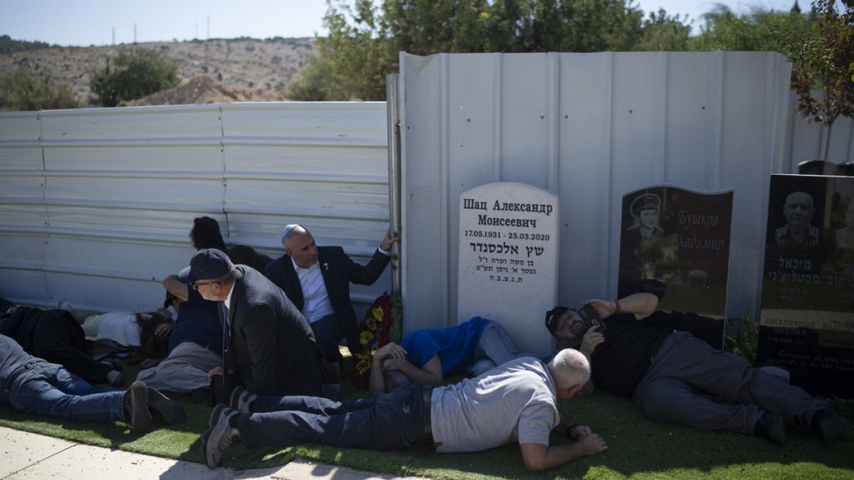 Video. Mourners take cover at cemetery in northern Israel during rocket attack from Lebanon