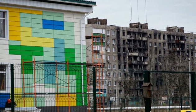 Invaders accommodate Russian arrivals in new apartment blocks erected to replace mutilated Ukrainian houses