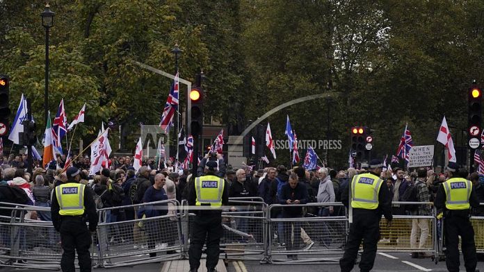 Supporters of far-right British figure rally as anti-racism demonstrators mount counter-protest