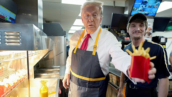 Trump works the fry station at McDonald's in a bid to attract working-class voters