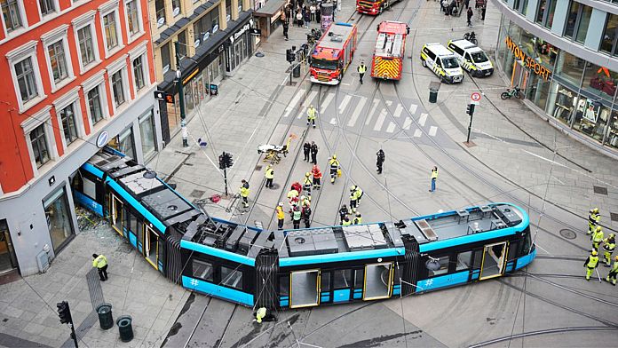 Four injured after derailed tram crashes into a shop in central Oslo