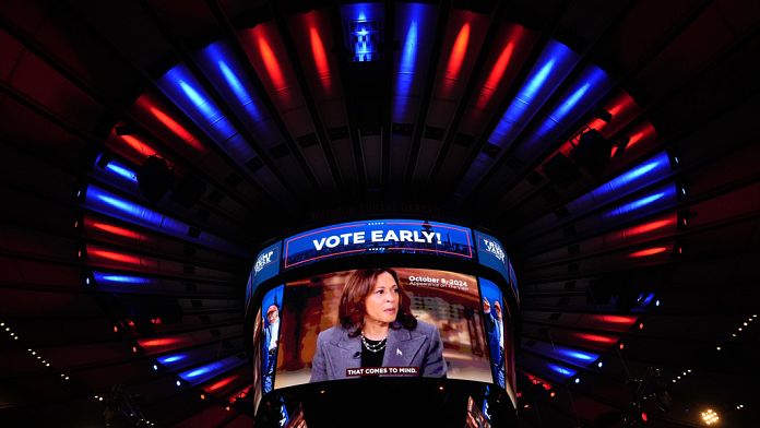 Trump rally marred by racist insults as Harris holds onto razor-thin lead