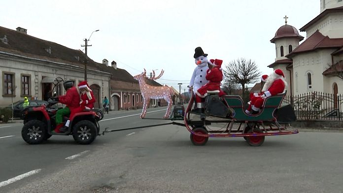 Santa's parade brings joy and sweets to Romania