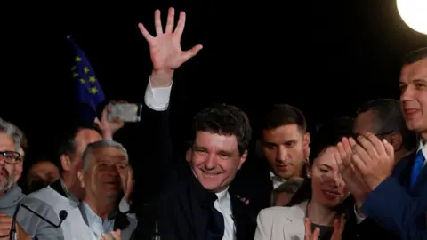 EPA-EFE/Shutterstock Nicusor Dan celebrates Romanian election win