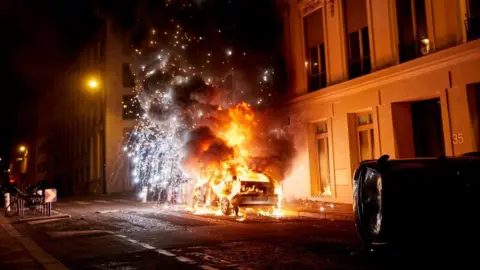 Getty Images A burning car
