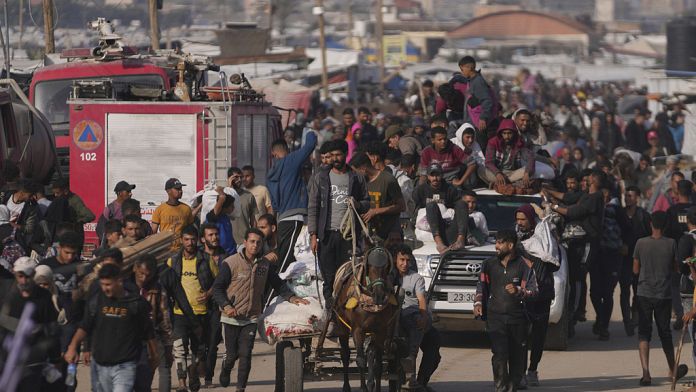 Dozens killed and scores injured in shooting near aid point in Gaza