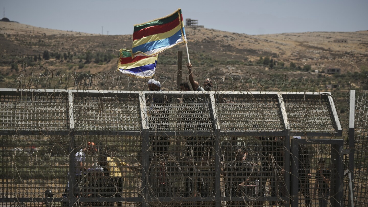 Israel strikes in Damascus as clashes between government forces and Druze groups in Syria rage on