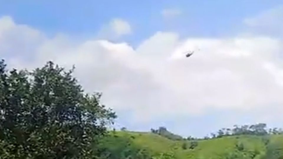 Attack on police helicopter and explosion near air base leave at least 14 dead in Colombia, officials say