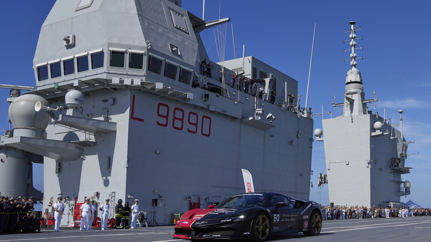 Italian driver aims to set record racing a Ferrari across an aircraft carrier
