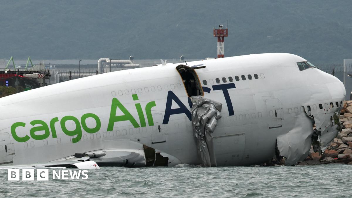 Hong Kong: Two dead after cargo plane skids off runway into sea – follow live