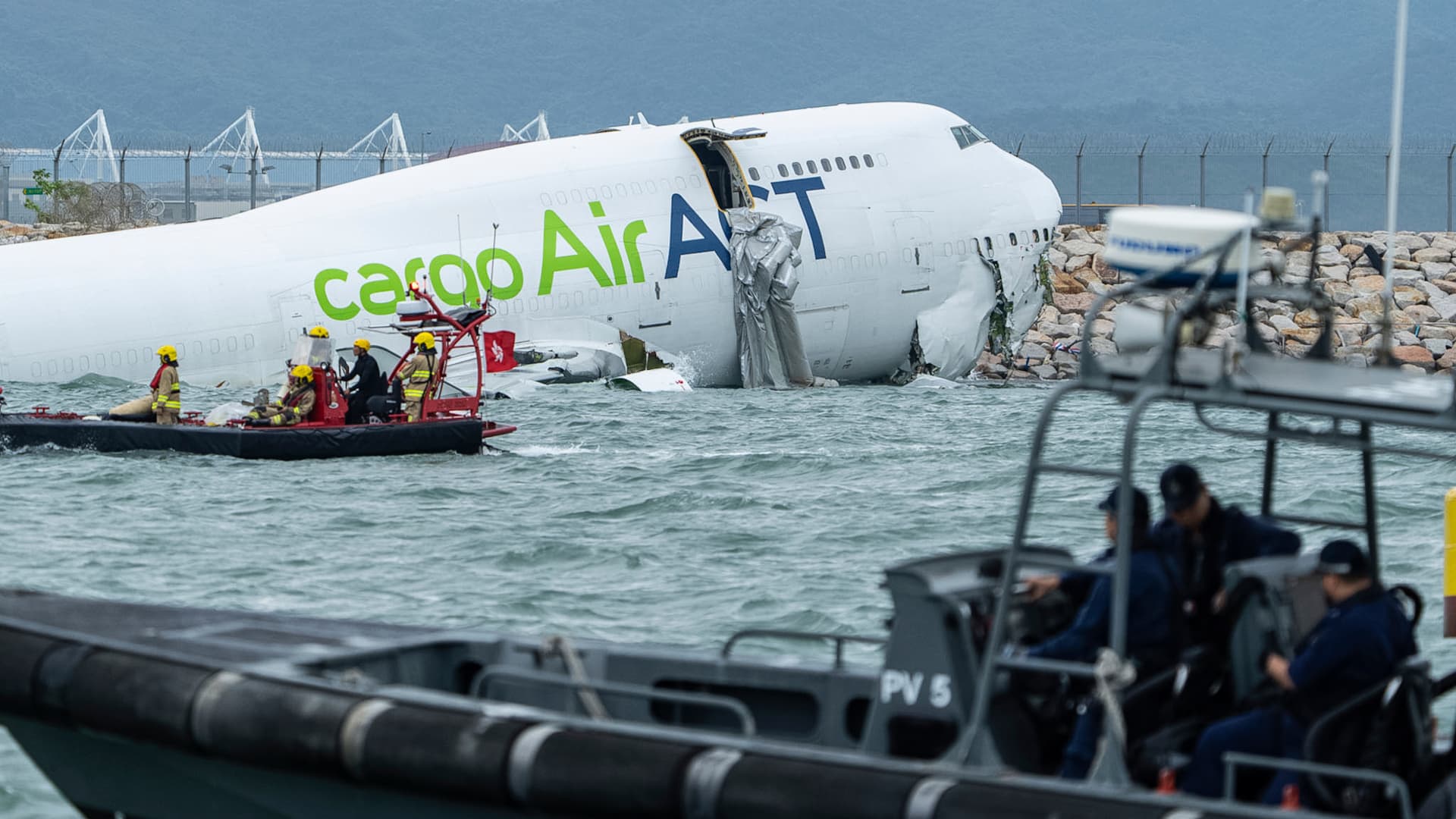 Cargo plane slides off runway falls into sea in Hong Kong