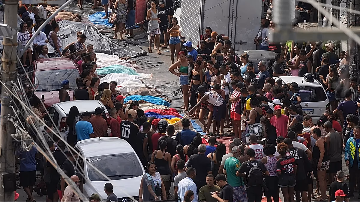 Angry families begin burying dead after police raid on Rio favela kills at least 132