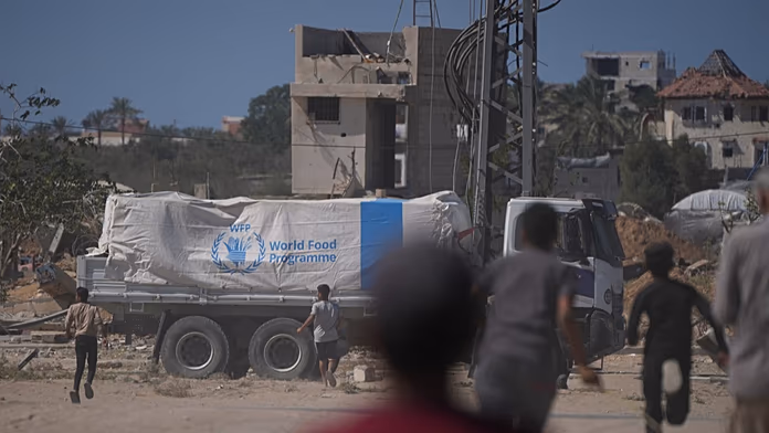 Aid begins to enter Gaza as Israel limits deliveries over alleged Hamas truce violations