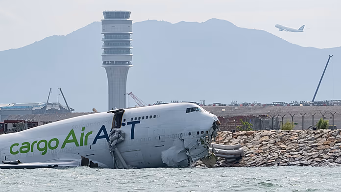 Cargo plane skids off Hong Kong runway, killing two airport workers