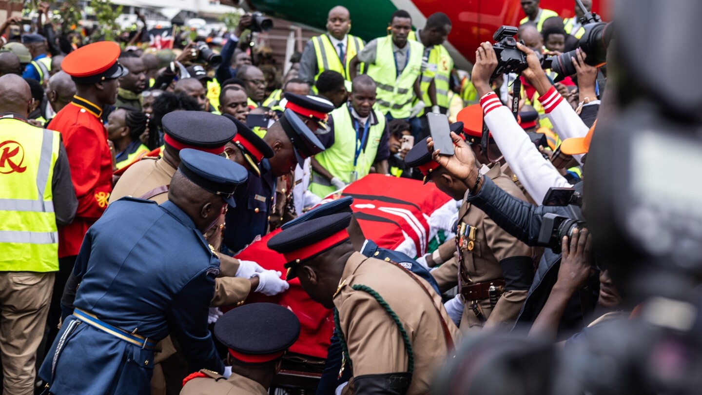 Kenya police fire at mourners and 2 die as violence erupts at viewing of body of ex-Premier Odinga