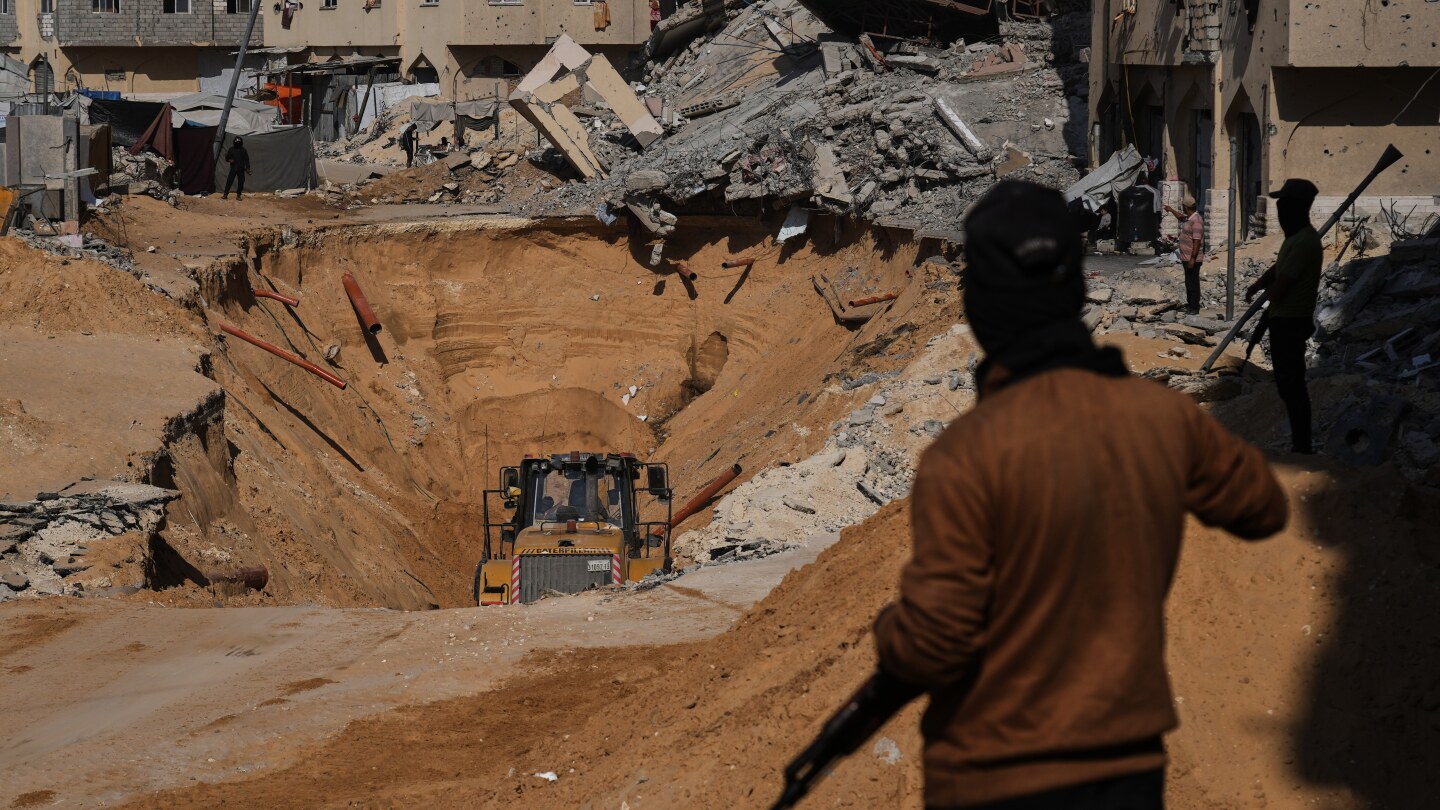 Israel identifies bodies of 2 hostages as major Gaza crossing remains closed