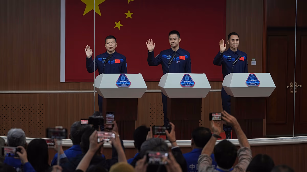 Chinese astronauts return to Earth after delay blamed on space debris damage