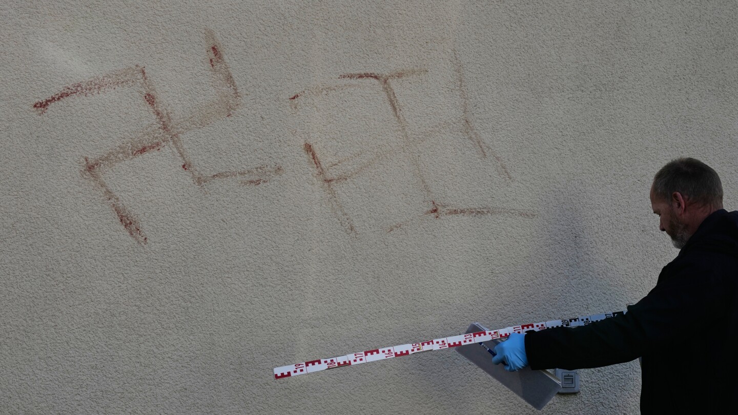 Police detain man who allegedly painted swastikas with his own blood on cars, buildings in Germany