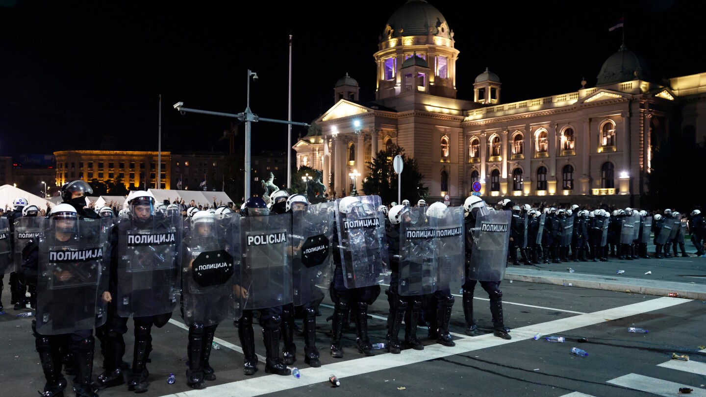 Riot police separate opponents, loyalists of Serbia’s president as tensions soar amid protests