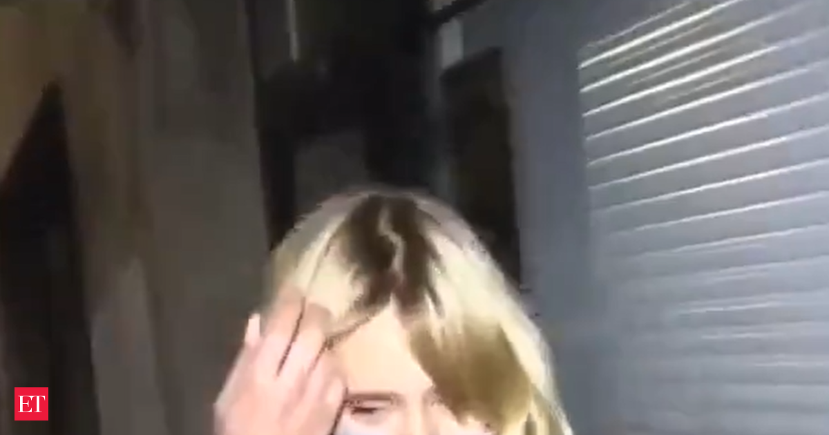 Putin’s alleged daughter says she’s ‘really sorry’ for the Ukraine war before being escorted away by a bodyguard—watch video