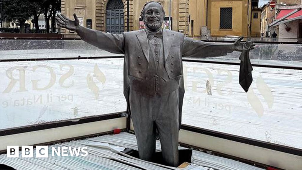 Pavarotti statue frozen knee-deep in ice rink strikes wrong note in Italy