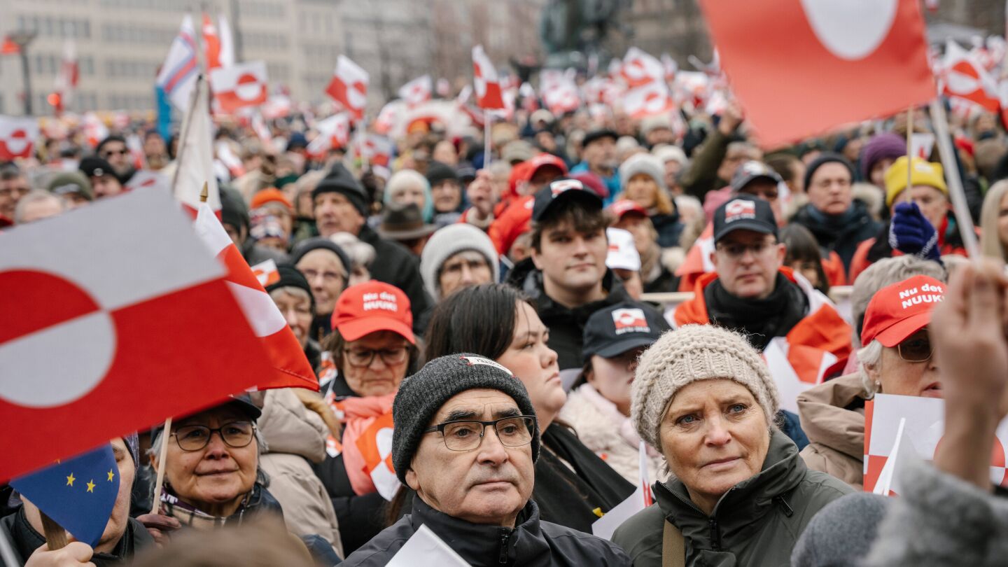 Pro-Greenland protesters wear hats spoofing Trump’s MAGA slogan