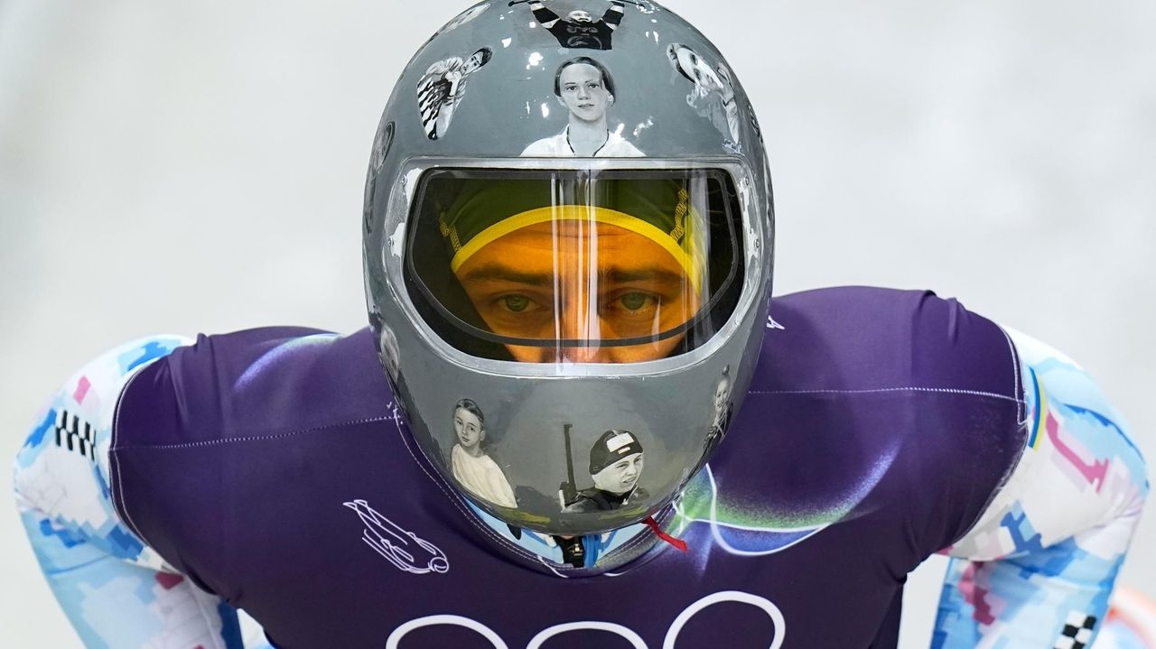 Ukrainian skeleton athlete Vladyslav Heraskevych trains again in banned helmet, despite IOC ruling
