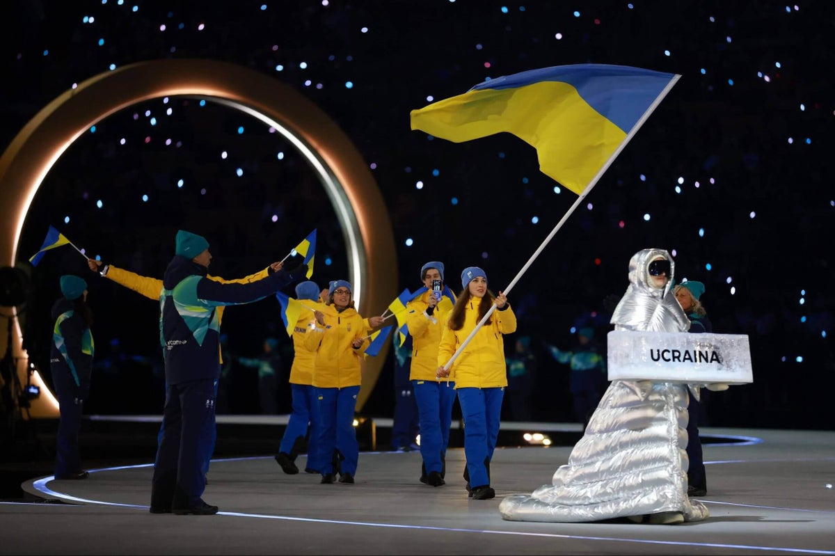 Ukraine’s Winter Olympians led out by Russian at opening ceremony