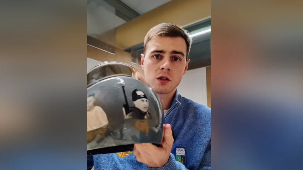 Ukraine’s Olympic flag bearer told to remove helmet honoring 591 athletes killed in war