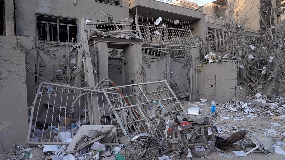 Video. Workers clear rubble after US-Israeli strikes damage buildings in Tehran