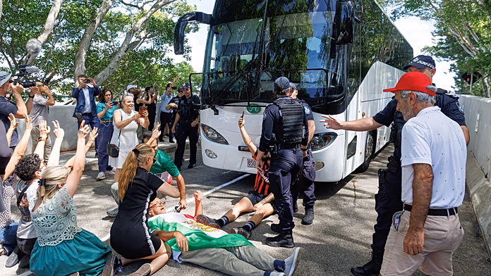 Protesters block bus carrying Iranian women’s team in Australia after five players granted asylum