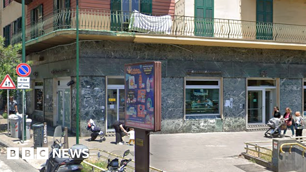 Naples bank robbers hold 25 people hostage then vanish through tunnel – BBC
